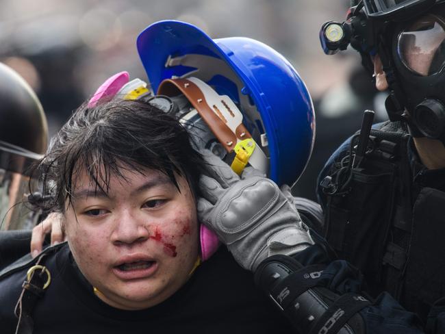 One of the protesters police detained who was attempting to escape Hong Kong Polytechnic University. Picture: AFP