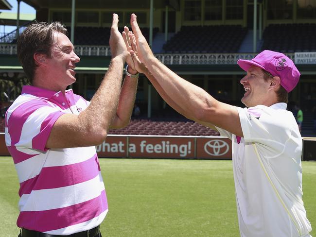 Shane Watson of Australia poses with Glenn McGrath to promote the McGrath Foundation Pink Test on January 3, 2015.