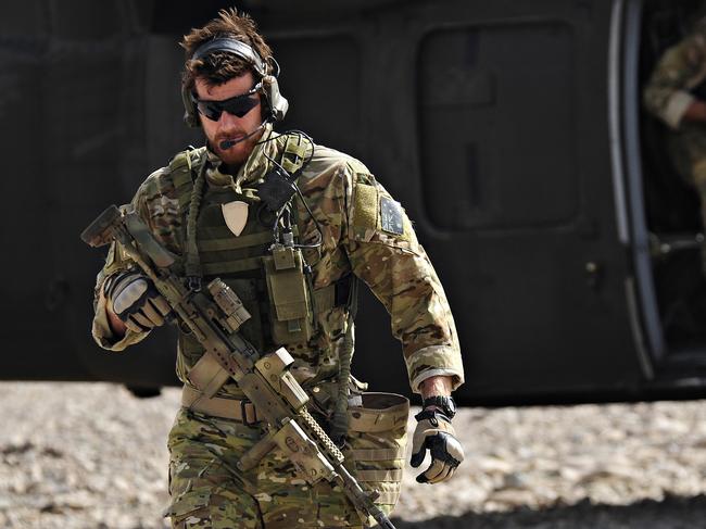 SAS Corporal Ben Roberts-Smith pictured leaving a UH-60 Blackhawk helicopter during preparation of the Shah Wali Kot offensive in Afghanistan in 2010.