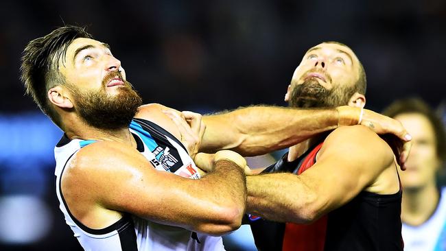 Charlie Dixon of Port Adelaide and Tom Bellchambers of Essendon battle it out in the ruck. Pictures: Mark Brake/Getty Images