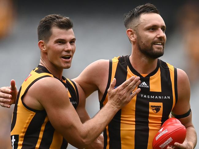 MELBOURNE, AUSTRALIA - MARCH 20: Jaeger O'Meara and Jack Gunston of the Hawks celebrate winning the round one AFL match between the Hawthorn Hawks and the North Melbourne Kangaroos at Melbourne Cricket Ground on March 20, 2022 in Melbourne, Australia. (Photo by Quinn Rooney/Getty Images)