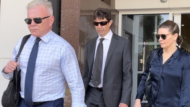 Ian De Silva walks out with lawyer Jon Tippett KC.