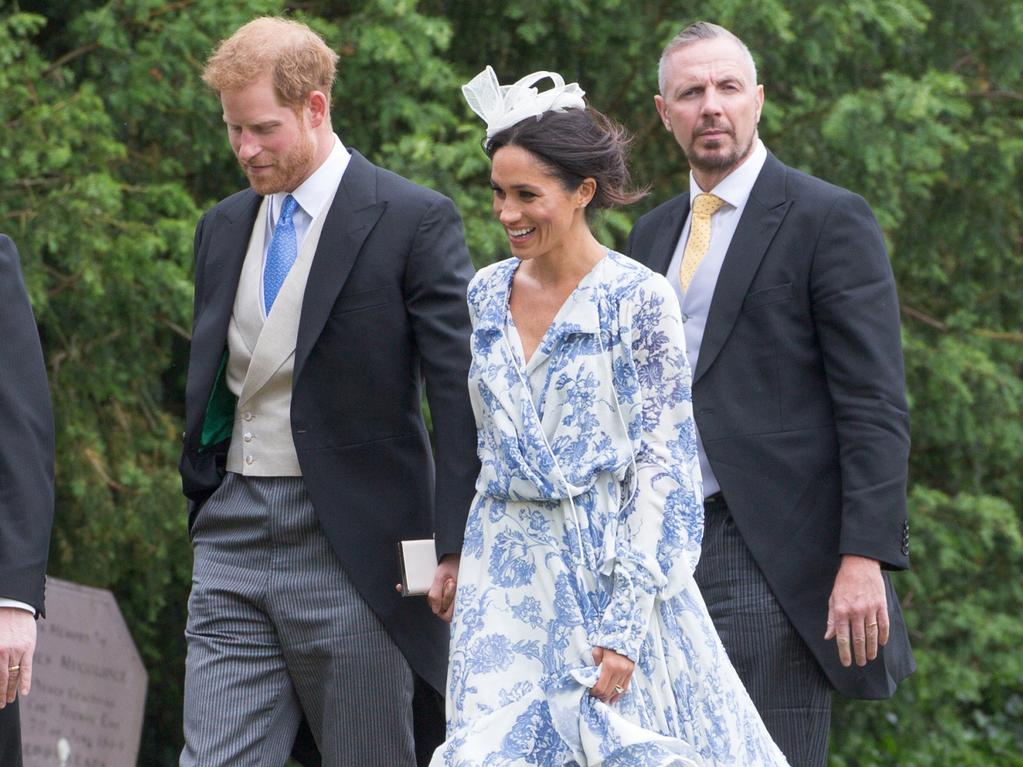 Meghan and Harry loved up at society wedding: Pictures | The Advertiser