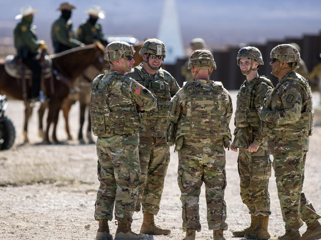 Army soldiers chat while waiting the arrival of Defense Secretary Pete Hegseth to the US-Mexico border. Picture: AP Photo/Andres Leighton
