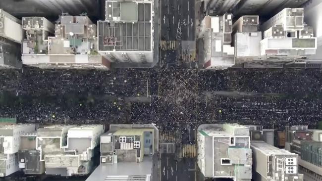 In this image from video and taken with a drone, protesters fill the Hennesy Road in Hong Kong, Sunday, June 16, 2019.  Hong Kong citizens marched for hours Sunday in a massive protest that drew a late-in-the-day apology from the city's top leader for her handling of legislation that has stoked fears of expanding control from Beijing in this former British colony.(Cable TV Hong Kong via AP)