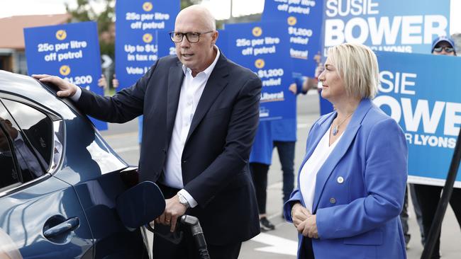 Peter Dutton and Liberal candidate for Lyons Susie Bower stopped for fuel to talk about the Coalition’s petrol price policy in Sorell in Hobart. Picture: Richard Dobson/NewsWire