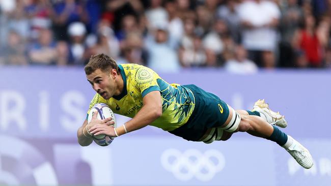 PARIS, FRANCE - JULY 27: Nathan Lawson of Team Australia scores a try in the Men’s Rugby Sevens Bronze Medal match between Team South Africa and Australia on day one of the Olympic Games Paris 2024 at Stade de France on July 27, 2024 in Paris, France. (Photo by Hannah Peters/Getty Images)