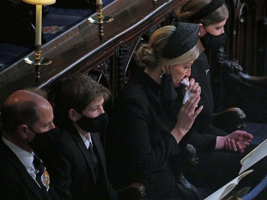 Sophie, Countess of Wessex, wipes away a tear as sits with her husband, Prince Edward, and the couple’s children, Lady Louise Windsor and James, Viscount Severn. Picture: Getty Images