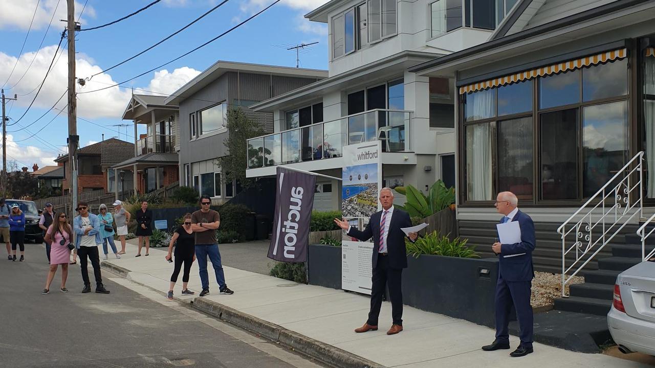 Whitford, Newtown auctioneer Dale Whitford and listing agent Tony Young in action.