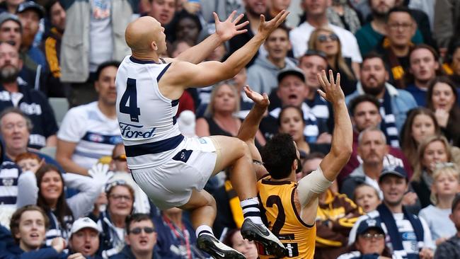 MELBOURNE, AUSTRALIA - APRIL 22: Gary Ablett of the Cats takes a spectacular mark over David Mirra of the Hawks during the 2019 AFL round 05 match between the Hawthorn Hawks and the Geelong Cats at the Melbourne Cricket Ground on April 22, 2019 in Melbourne, Australia. (Photo by Michael Willson/AFL Photos)