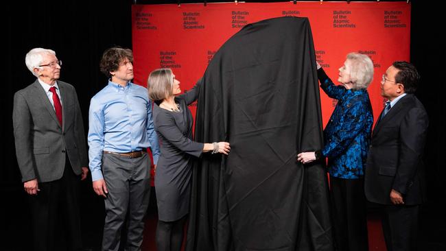 Members of the Bulletin of the Atomic Scientists unveil the Doomsday Clock during an announcement in Washington. Picture: AFP