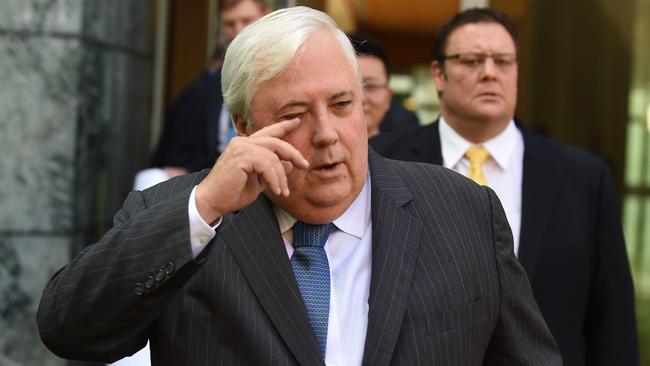 PUP leader Clive Palmer (C) and PUP Senator Glenn Lazarus (R) arrive for a press conference at Parliament House ahead of the Intergeneratiolal Report to be released on Thursday, Canberra, Wednesday, March 4, 2015. (AAP Image/Mick Tsikas) NO ARCHIVING