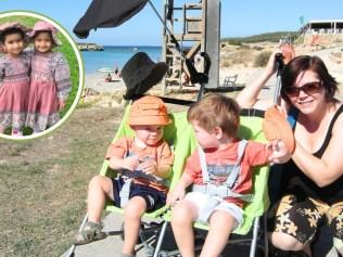 Karen with one of the strollers she used for her twins over the years. Image: Supplied