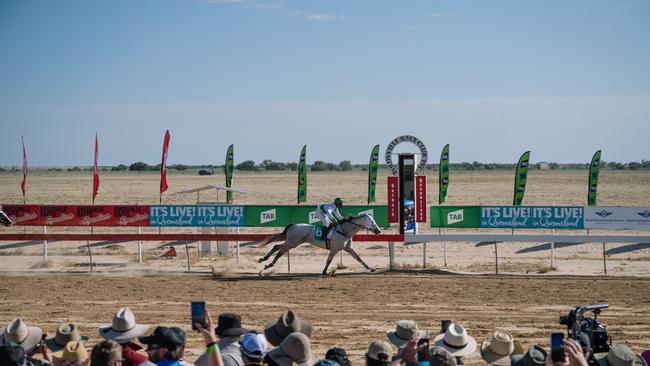 Justin Potter rides the Phillip Stokes-trained Neodium to a clear win in the Birdsville Cup on Saturday. Picture: Matt Williams