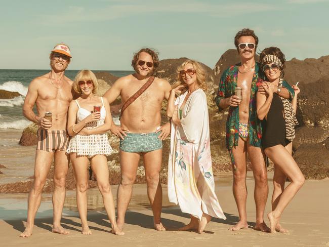 Julian McMahon (second from right) planted a smacker on his ex sister-in-law Kylie Minogue (second from left) while shooting Swinging Safari in Queensland. The expat actor says Kylie’s reaction was priceless. Picture: Becker Film Group