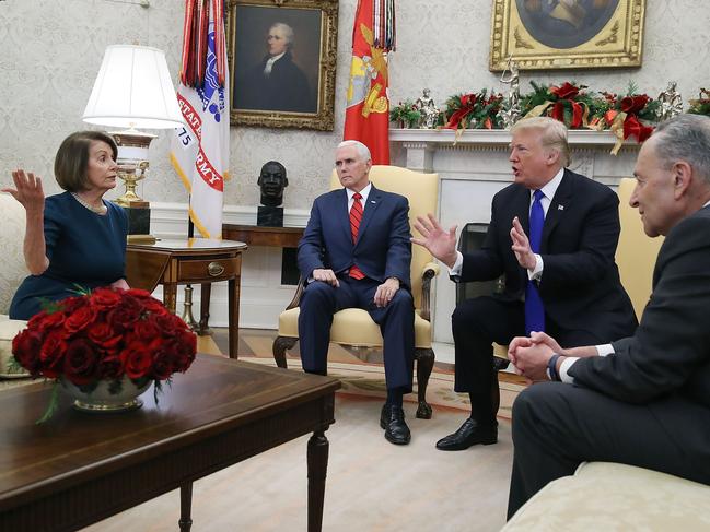 WASHINGTON, DC - DECEMBER 11: U.S. President Donald Trump (2R) argues about border security with Senate Minority Leader Chuck Schumer (D-NY) (R) and House Minority Leader Nancy Pelosi (D-CA) as Vice President Mike Pence sits nearby in the Oval Office on December 11, 2018 in Washington, DC.   Mark Wilson/Getty Images/AFP == FOR NEWSPAPERS, INTERNET, TELCOS & TELEVISION USE ONLY ==