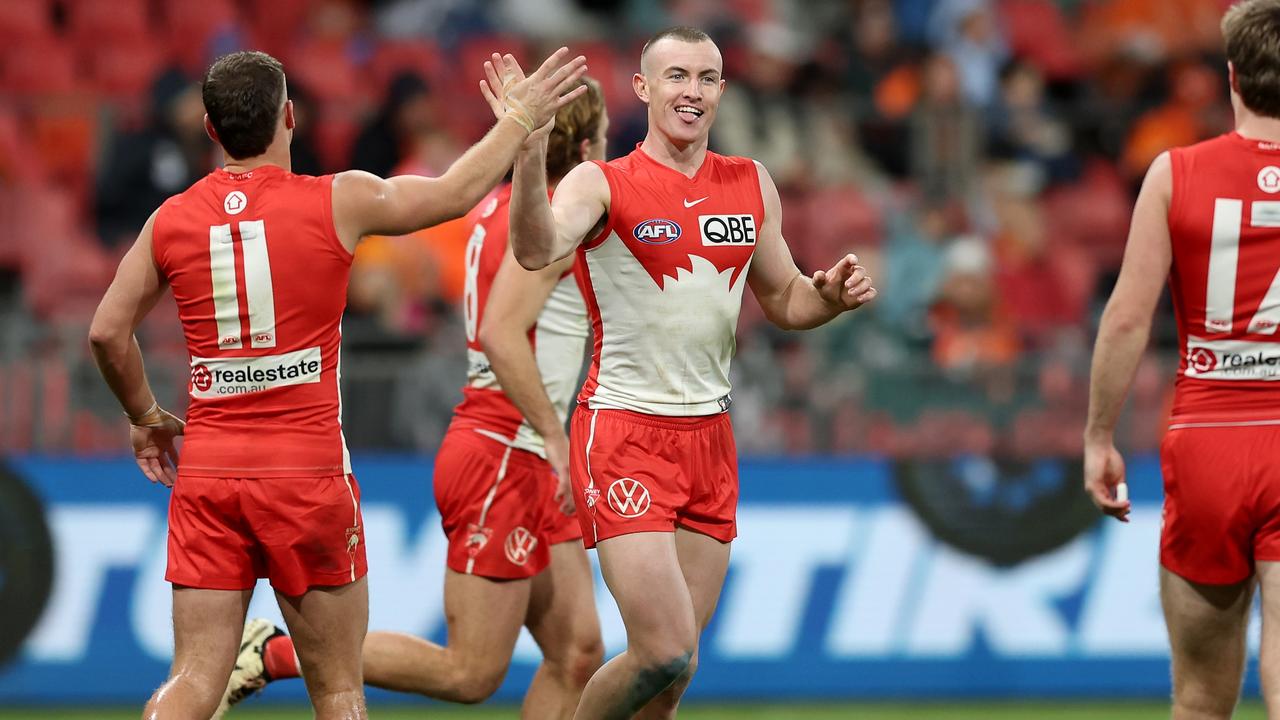 SYDNEY, AUSTRALIA - JUNE 22: Chad Warner of the Swans celebrates with team mates after kicking a goal during the round 15 AFL match between Greater Western Sydney Giants and Sydney Swans at ENGIE Stadium, on June 22, 2024, in Sydney, Australia. (Photo by Matt King/AFL Photos/Getty Images)