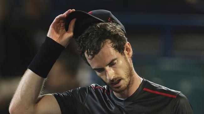 FILE — In this Friday, Dec. 29, 2017, file photo, Great Britain's Andy Murray reacts after he lost a match to Spain's Roberto Bautista Agut during the second day of the Mubadala World Tennis Championship in Abu Dhabi, United Arab Emirates. Murray has withdrawn from the Brisbane International because of a problem with his right hip. The former No. 1-ranked Murray had been scheduled to play his first match on Thursday, but notified organisers he was pulling out after failing to practice on Tuesday. (AP Photo/Kamran Jebreili, File)