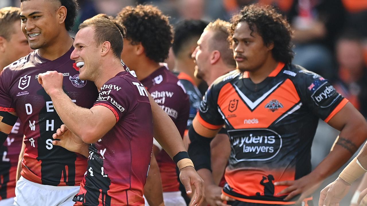 Daly Cherry-Evans of the Sea Eagles celebrates scoring a try.