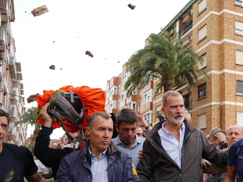 Not happy: King Felipe VI of Spain is heckled by angry residents who throw mud and objects during his visit to Paiporta, in the region of Valencia, eastern Spain, on November 3, 2024, in the aftermath of devastating deadly floods. Picture: AFP