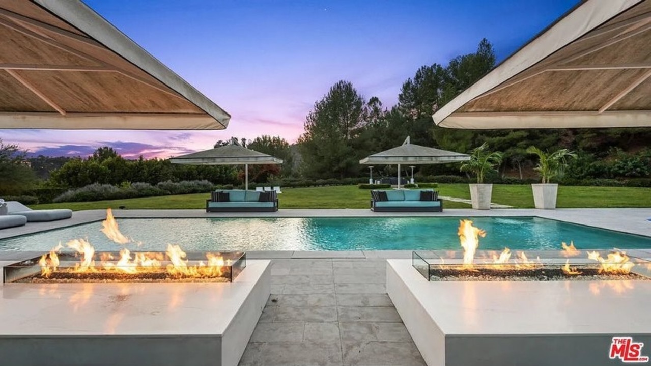 There is also a stunning pool area, complete with its own pool house. Picture: Realtor