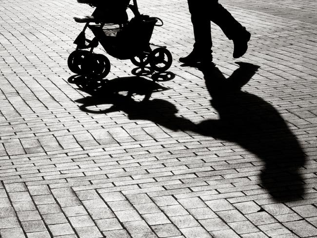 Black And White Shadow Of Baby Stroller On Sidewalk Stones