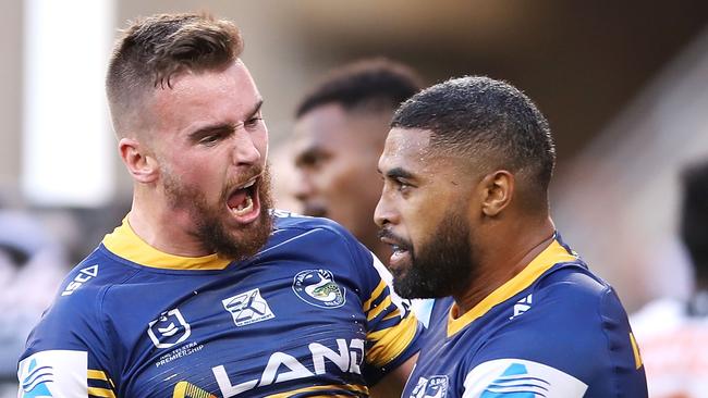 SYDNEY, AUSTRALIA — APRIL 22: Clint Gutherson and Michael Jennings of the Eels celebrate Jennings scoring a try during the round 6 NRL match between the Parramatta Eels and Wests Tigers at Bankwest Stadium on April 22, 2019 in Sydney, Australia. (Photo by Mark Kolbe/Getty Images)