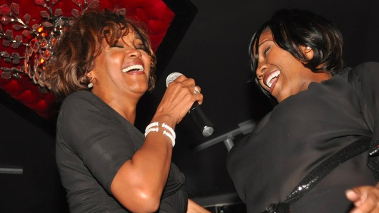 Whitney Houston’s last ever public performance, with friend Kelly Price (right) on February 9, 2012. Picture: Splash