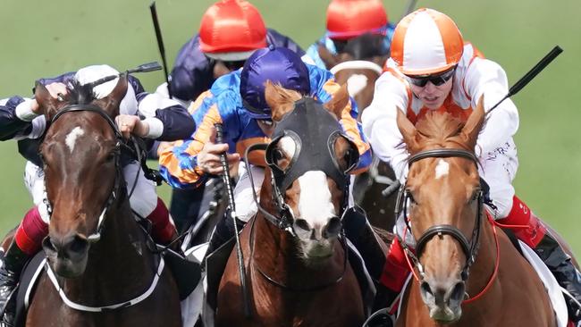 Frankie Dettori and Master of Reality close in on Il Paradiso and winner Vow and Declare in the run to the line. Picture: Michael Dodge.