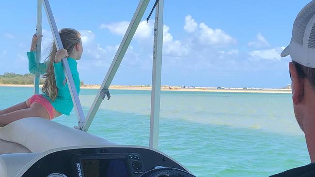 Anthony Bell pilots a boat while one of his daughters enjoys the view. The photo appeared on a Kelly Landry social media post.