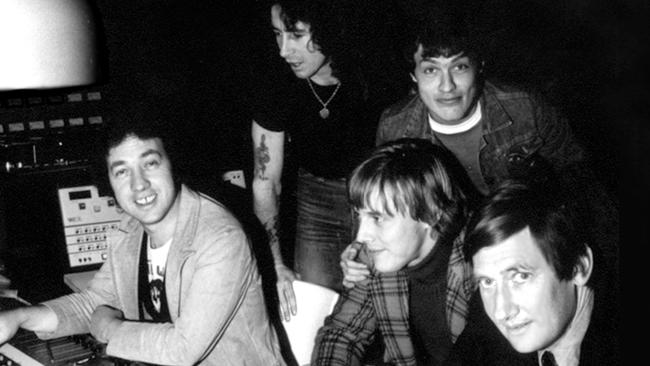 Bon Scott and Angus Young, standing, with George Young, Harry Vanda and Ted Albert in Albert Studio.