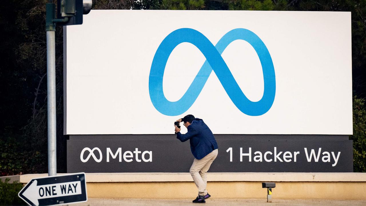 A man takes a photo at Meta corporate headquarters in Menlo Park, California on November 9, 2022. Picture: Josh Edelson / AFP