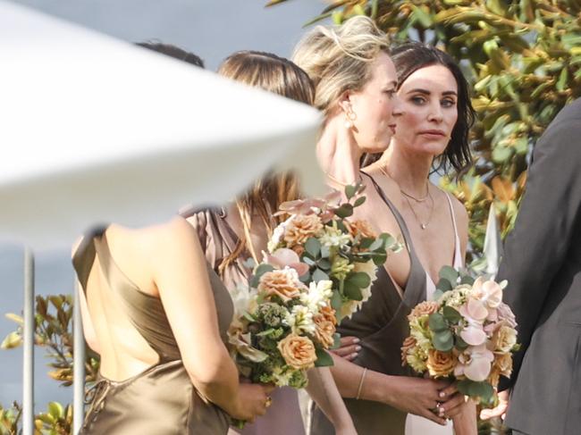 Cox’s daughter Coco (left) reported for duty as one of the bridesmaids. Picture: ©MEDIA-MODE.COM