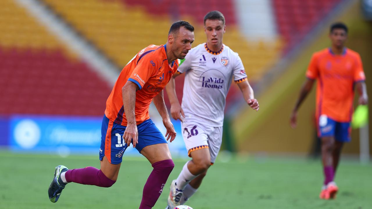Roar playmaker Florin Berenguer (left) is understood to have remained with his family in Brisbane due to the impending Cyclone Alfred rather than travel to Adelaide for a match this weekend. Picture: Chris Hyde/Getty Images