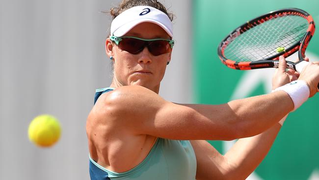 Samantha Stosur plays a backhand in her second round match against Shuai Zhang of China. Picture: Getty
