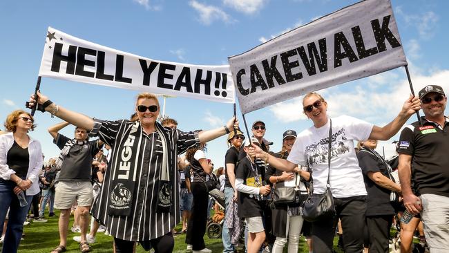 Lindy Franklyn and Rosie Webb, who became friends through Collingwood, join in the celebrations at Olympic Park. Picture: Ian Currie