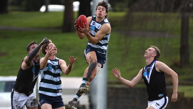 Nicholas Lucena takes a mark for Old Geelong against Ormond.Photo: Hamish Blair