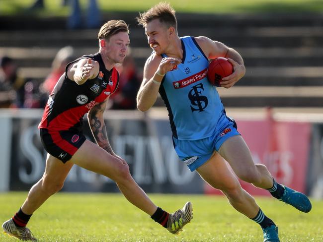 2/6/2018 SANFL: Rory Taggert of the Double Blues is tackled by Errin Wasley Black of the Bloods. West Adelaide v Sturt at Richmond Oval. Picture MATT TURNER.