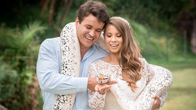 Chandler Powell and Bindi Irwin on their wedding day with a python. Picture: Kate Berry