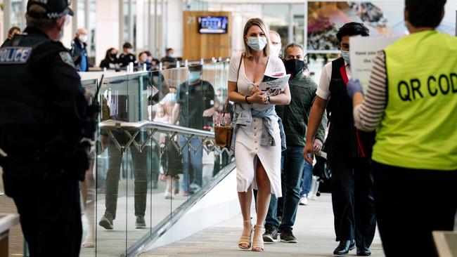 Police and health authorities away arrivals at Adelaide Airport. Picture: Morgan Sette