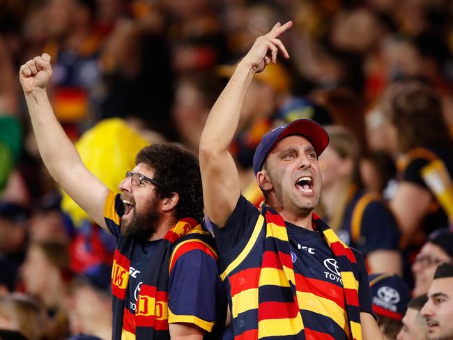 Crows fans celebrate after Adelaide wins into the Grand Final — but many fans will miss out on tickets to the match. Picture: Adam Trafford/AFL Media/Getty