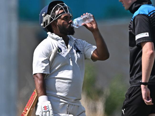 VTCA: Sydenham-Hillside batter Gayashan Weerasekara cools off. Picture: Andy Brownbill