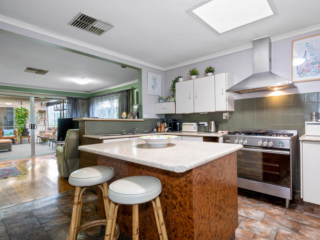 The kitchen and island bench.