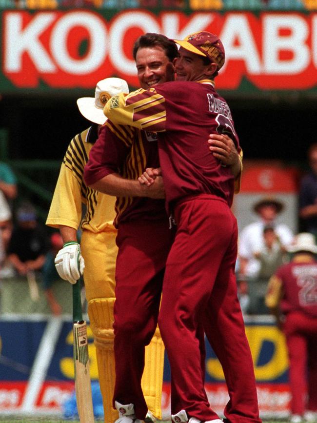 SCOTT PRESTWIDGE GETS HUG FROM JIM MAHER..