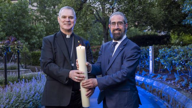 Rabbi Yaakov Glasman and Archbishop Peter A Comensoli mark the first day Hanukkah and Christmas have lined up since 2005. Picture: Wayne Taylor