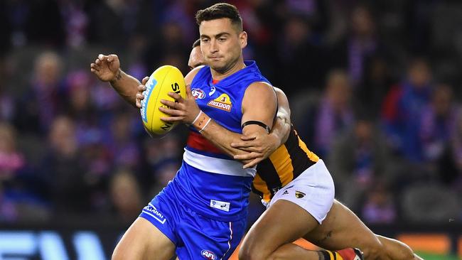 Luke Dahlhaus is tackled by Jarman Impey.