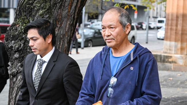 Sang Van Huynh, right, leaves the Adelaide Magistrates Court with his lawyer Son Nguyen. Picture: NCA NewsWire / Brenton Edwards