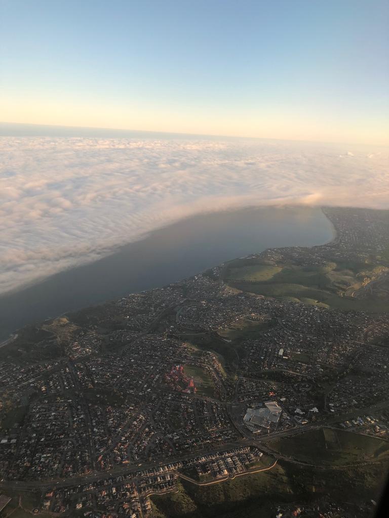 Low cloud and fog over Adelaide, seen from a Melbourne-Adelaide Qantas flight. The flight was diverted back to Melbourne. Picture: Darren Watson