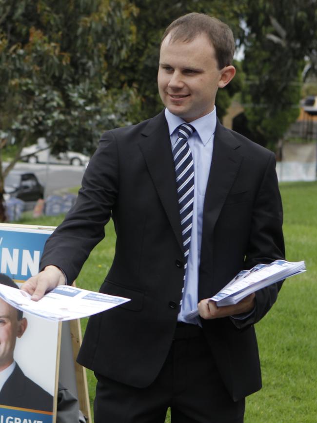 Liberal candidate Courtney Mann hands out how to vote cards in Mulgrave