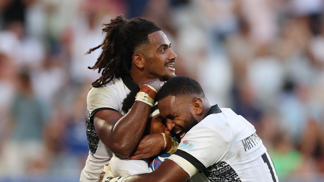 BORDEAUX, FRANCE - SEPTEMBER 30: Vinaya Habosi of Fiji celebrates scoring his team's second try with teammates Selestino Ravutaumada and Temo Mayanavanua of Fiji during the Rugby World Cup France 2023 match between Fiji and Georgia at Nouveau Stade de Bordeaux on September 30, 2023 in Bordeaux, France. (Photo by Phil Walter/Getty Images)